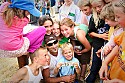 The winner and his fans with $100 bill.