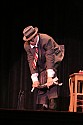 Bill Irwin does a quick costume change on stage at Cotton Auditorium, Fort Bragg CA