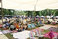 Some of the audience enjoys the shade of a canopy at the Kate Wolf festival 2005